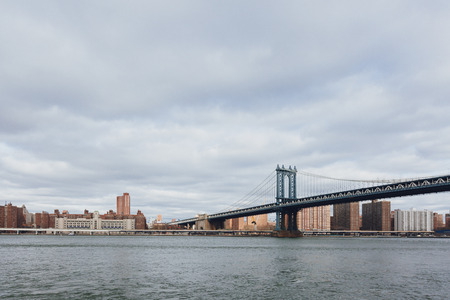 Manhattan skyline viewed from Brooklyn with Manhattan bridge over East River, in New York City, USAの写真素材