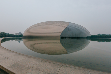 Exterior view of National Centre for the Performing Arts and its reflection in the pool, in Beijing, Chinaのeditorial素材