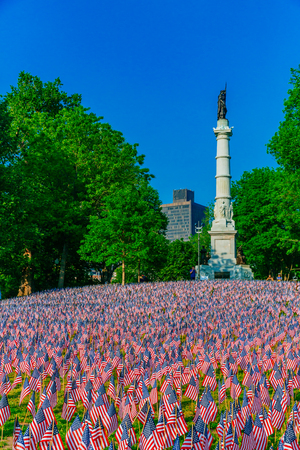Boston, USA - May 27, 2016: View of thousands of US flags planted in Boston Common, to commemorate fallen soldiers in wars, during Memorial Day weekendのeditorial素材