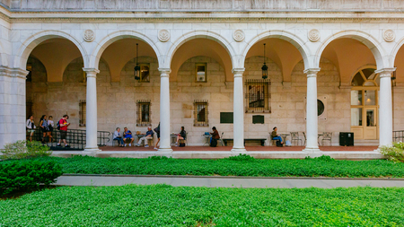 Boston, USA - May 27, 2016: View of arched corridor and inner courtyard of Boston Public Library, where locals rest or gatherのeditorial素材