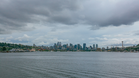 View of skyline of downtown Seattle over Lake Union under clouds, in Seattle, USAの写真素材