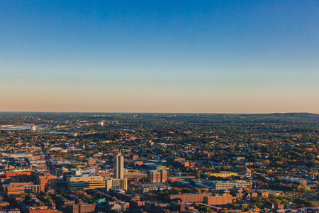 Aerial views of buildings and houses under blue sky at sunset, in Boston, USAのeditorial素材