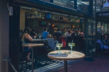 Boston, USA: May 20, 2017: Locals eating at restaurants at Quincy Market in Faneuil Hall Marketplace in downtown Bostonのeditorial素材