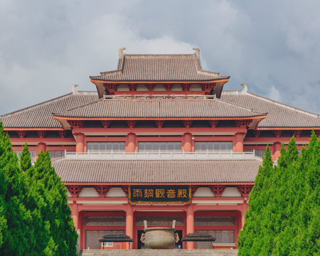 View of traditional Chinese architecture in Chongsheng Temple against Cangshan Mountains covered in...