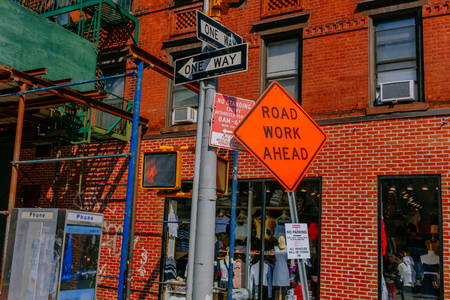 New York City, USA - Aug. 5, 2018: Street signs in front of a building in Manhattanのeditorial素材