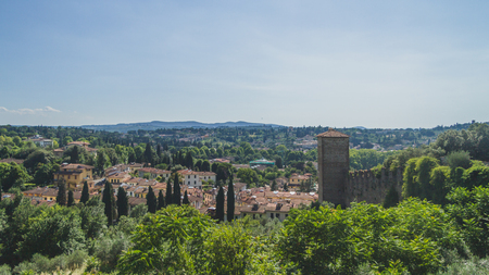 View of houses between trees on hills outside of the city center of Florence, Italyの写真素材