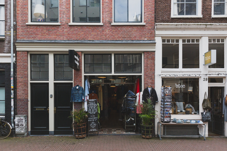 Amsterdam, the Netherlands - March 5, 2017: Vintage clothes shops in downtown Amsterdamのeditorial素材