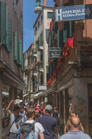 Venice, Italy - June 6, 2017: Busy alley street filled with touristsのeditorial素材
