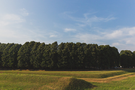 View of trees and grassland outside of the city walls of Lucca, Tuscany, Italyの写真素材