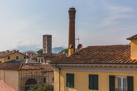 View of towers over buildings in Lucca, Tuscany, Italyの写真素材