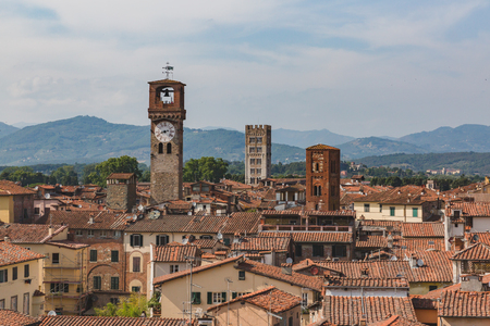 View of towers over houses of historic centre of Lucca, Italy, viewed from the tower of former church of Saints Giovanni and Reparataのeditorial素材
