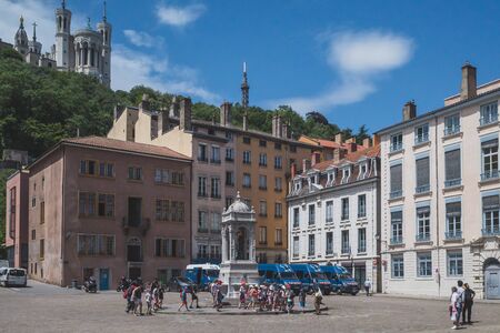 June 18, 2019 - Lyon, France: People walking across Saint-Jean Square in Old Lyonのeditorial素材