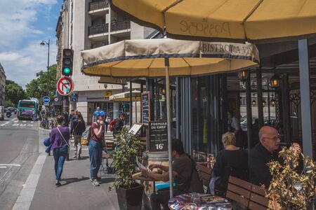 June 14, 2019 - Paris, France: cafe restaurant next to street in downtown Parisのeditorial素材