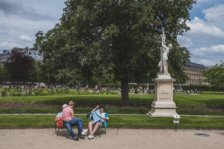 June 14, 2019 - Paris, France: People relaxing in Tuileries Garden in downtown Parisのeditorial素材
