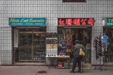 June 14, 2019 - Paris, France: man shopping at Asian gift shop in 13th arrodissement in Parisのeditorial素材