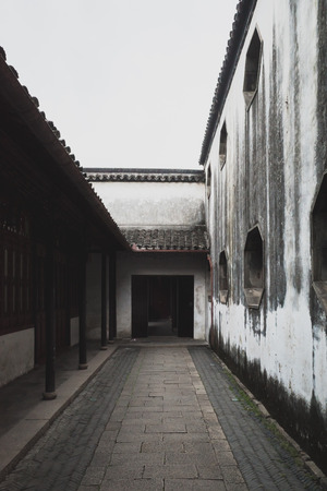 Traditional Chinese doorway and architecture at Tuisi Garden in the old town of Tongli, Jiangsu, Chinaのeditorial素材