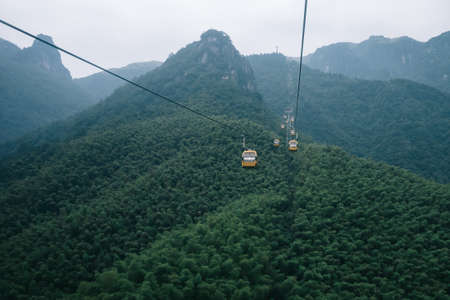 Cable cars traveling on Wugong Mountain in Jiangxi, Chinaの写真素材