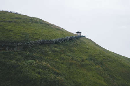 Wooden walking path leading to pavilion on Wugong Mountain in Jiangxi, Chinaの写真素材