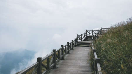 Wooden walking path across meadow on Wugong Mountain in Jiangxi, Chinaの写真素材