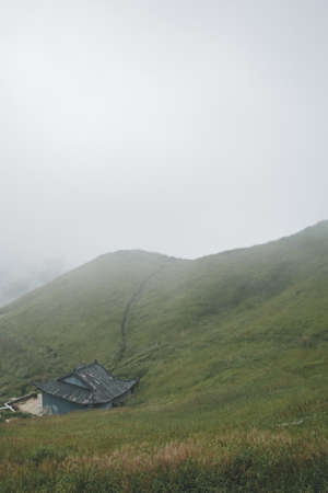 House among grassland on top of Wugong Mountain in Jiangxi, Chinaのeditorial素材