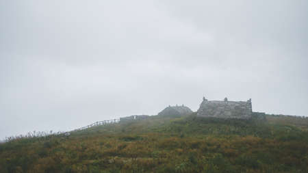 House among grassland on top of Wugong Mountain in Jiangxi, Chinaのeditorial素材