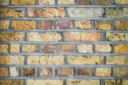 Background texture of yellow brick wall