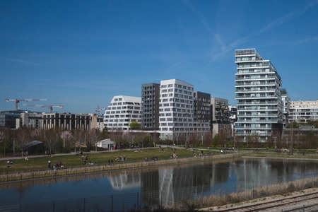 Paris, France - March 29, 2021: Locals enjoying a sunny afternoon outside in Martin-Luther-King Park in 17th arrondissementのeditorial素材