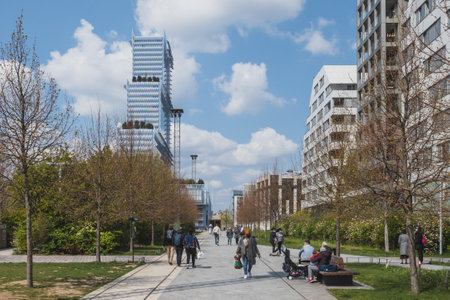 Paris, France - April 17, 2021: Locals enjoying a sunny afternoon outside in Martin-Luther-King Park in 17th arrondissementのeditorial素材