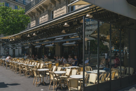 Paris, France - June 23, 2019: People dining in the terrace of a restaurant in Arts et Metiers...