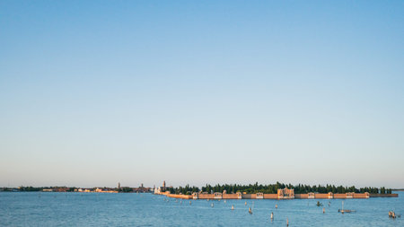 Island and cemetery of San Michele under blue sky in Venice, Italy