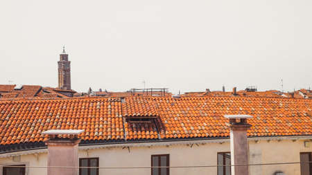 Tower over traditional Venetian houses in Venice, Italyの写真素材