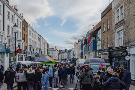 London, United Kingdom - January 1, 2021: People gather at Portobello Road Market with tents of vendors on road in Notting Hill, Londonのeditorial素材