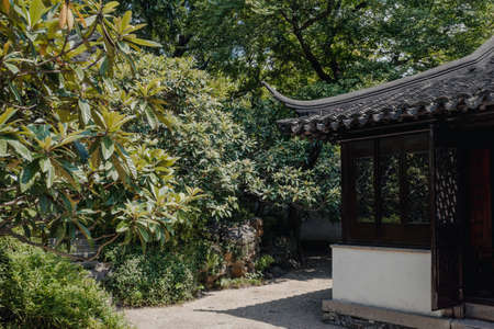 Traditional architecture among trees at Humble Administrator's Garden (Zhuozhengyuan) Suzhou, Chinaのeditorial素材