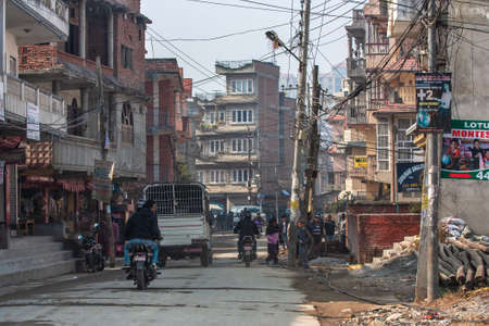 Kathmandu, Nepal - January 2011: downtown dusty street.のeditorial素材