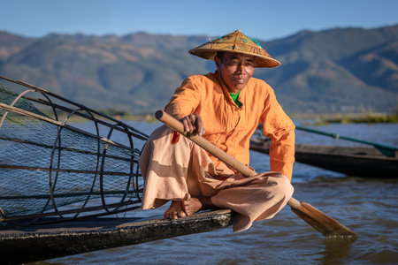 Inle lake, Myanmar - December 2019: fisherman rest on boat. High quality photoのeditorial素材