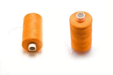Close-up of an orange thread isolated on whiteの写真素材