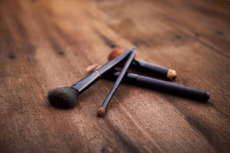 set of brushes for makeup.rouge/brusher, Brush Set on wood brown backgroundの写真素材