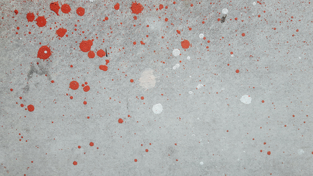 red white color splash on wall backgorundの写真素材