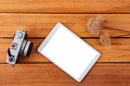 ative flat lay photo of workspace desk with retro camera on wood table