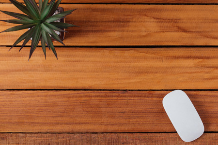 office mouse on wood table background