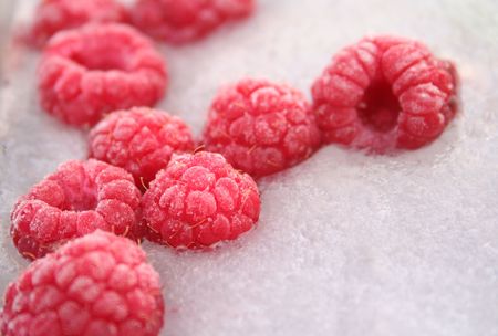 Raspberries frozen in ice