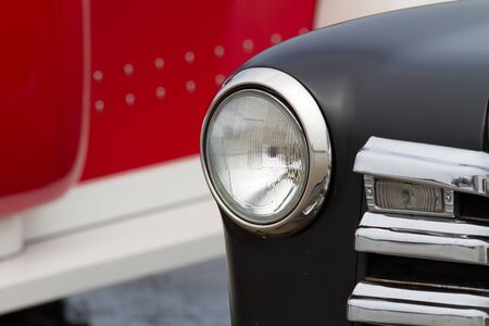 Round headlight of a vintage car.