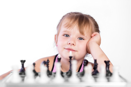 smart girl playing chessの写真素材