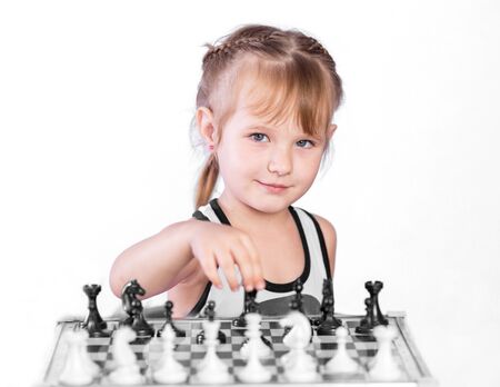 smart girl playing chessの写真素材