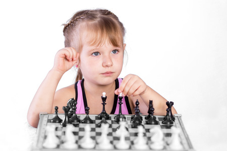smart girl playing chessの写真素材