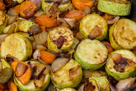 Stewed zucchini, fried onions, carrots and garlic.の写真素材