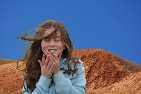 Girl in desert smilingの写真素材