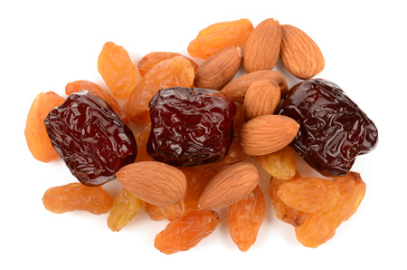Raisins, almonds and dates on white backgroundの写真素材