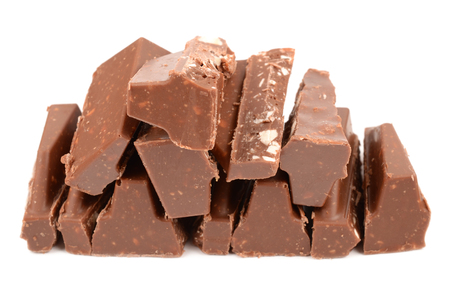 delicious milk chocolate with nuts on a white backgroundの写真素材