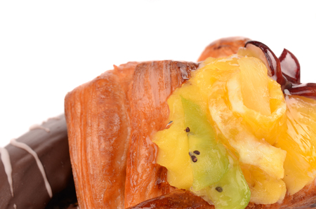 Isolated delicious pastries with fruit and poppy seeds on white backgroundの写真素材